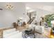 Open-concept living space with tile flooring, modern decor, and staircase at 8801 Rozetta Ct, Las Vegas, NV 89134