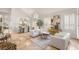 Spacious living room featuring modern furnishings, tile floors, and abundant natural light at 8801 Rozetta Ct, Las Vegas, NV 89134