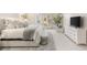 Bright main bedroom featuring white décor, French doors, and modern furnishings at 8801 Rozetta Ct, Las Vegas, NV 89134