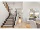 Grand staircase featuring a modern railing design, plush carpeting, and travertine floors throughout the home at 8801 Rozetta Ct, Las Vegas, NV 89134