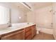 Bathroom featuring a double vanity, tile flooring, and bathtub at 9044 Crimson Clover Way, Las Vegas, NV 89134