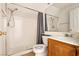 Bathroom featuring a combined shower and tub, toilet, and wooden vanity at 9044 Crimson Clover Way, Las Vegas, NV 89134