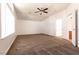 Bright and spacious bedroom with plush carpeting and a ceiling fan at 9044 Crimson Clover Way, Las Vegas, NV 89134