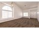 Spacious living room with high ceilings, a large window, and neutral carpet, offering ample natural light at 9044 Crimson Clover Way, Las Vegas, NV 89134