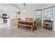 Dining room featuring modern furniture, wood floors, and a view into the kitchen at 9284 Lopseed Ct, Las Vegas, NV 89149