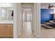Open concept home featuring a hallway view into the living room and a secondary bathroom at 9284 Lopseed Ct, Las Vegas, NV 89149