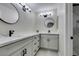 Modern bathroom with dual sinks, white countertops, and updated fixtures for a luxurious feel at 9436 Mount Cash Ave # 101, Las Vegas, NV 89129