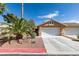 Charming single-story home with a well-manicured yard, desert landscaping, and a two-car garage at 9436 Mount Cash Ave # 101, Las Vegas, NV 89129