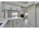 Spacious kitchen features marble countertops, white cabinets, and an open floor plan at 9436 Mount Cash Ave # 101, Las Vegas, NV 89129