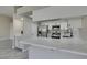 Bright kitchen boasts marble countertops, stainless steel appliances, and white cabinetry at 9436 Mount Cash Ave # 101, Las Vegas, NV 89129