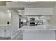 Bright kitchen boasts marble countertops, stainless steel appliances, and white cabinetry at 9436 Mount Cash Ave # 101, Las Vegas, NV 89129