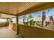 Covered patio with views of the surrounding greenery and neighborhood at 9436 Mount Cash Ave # 101, Las Vegas, NV 89129
