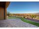 Paved backyard patio with desert landscaping and mountain views at 1130 Calico Rdg, Mesquite, NV 89034