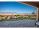 Backyard patio with brick pavers and desert landscaping offering stunning mountain views at 1130 Calico Rdg, Mesquite, NV 89034