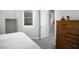 Bright bedroom features plush carpeting, shuttered window, and classic wood dresser at 1130 Calico Rdg, Mesquite, NV 89034