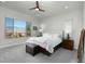 Bright bedroom with a view, a ceiling fan, carpeted floors, and neutral décor at 1130 Calico Rdg, Mesquite, NV 89034