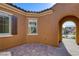Mediterranean-style front courtyard showing stucco exterior and window shutters at 1130 Calico Rdg, Mesquite, NV 89034