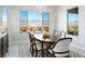 Bright dining room with a modern table and large windows showcasing mountain views at 1130 Calico Rdg, Mesquite, NV 89034