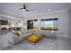 Spacious living room with modern furnishings and large windows showcasing scenic views at 1130 Calico Rdg, Mesquite, NV 89034