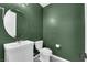 This powder room features a modern sink, fixtures, and decorative flooring at 375 Elks Peak Ave, North Las Vegas, NV 89084