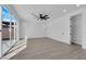 This bedroom features modern ceiling fan, wood floors, natural light, and a spacious walk-in closet at 375 Elks Peak Ave, North Las Vegas, NV 89084