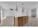 Bright, open floor plan with an island kitchen, quartz countertops and wood flooring at 375 Elks Peak Ave, North Las Vegas, NV 89084