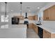Modern kitchen with stainless steel appliances, quartz countertops and oversized kitchen island at 375 Elks Peak Ave, North Las Vegas, NV 89084