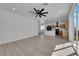 Open living space features an island kitchen and modern wood-look flooring at 375 Elks Peak Ave, North Las Vegas, NV 89084