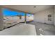 The covered back patio has a concrete base with plenty of room for seating at 4010 Herblinda Ln, North Las Vegas, NV 89032