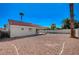 Backyard featuring a covered patio, rock landscaping and perimeter fencing for privacy and outdoor activities at 4010 Herblinda Ln, North Las Vegas, NV 89032