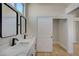Bathroom with double vanity and access to closet space at 4010 Herblinda Ln, North Las Vegas, NV 89032