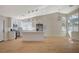 Spacious kitchen with white cabinets, stainless steel appliances, and an island, all bathed in natural light at 4010 Herblinda Ln, North Las Vegas, NV 89032