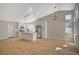 Bright, open-concept kitchen boasts stainless appliances, an island, and lots of natural light at 4010 Herblinda Ln, North Las Vegas, NV 89032