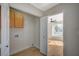 This laundry area is next to the bedroom and includes a cabinet and storage at 4010 Herblinda Ln, North Las Vegas, NV 89032