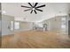 Spacious open-concept living area with light wood floors, connecting seamlessly to a modern kitchen at 4010 Herblinda Ln, North Las Vegas, NV 89032