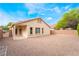 House backyard with gravel and surrounding trees at 4360 Meadowlark Wing Way, North Las Vegas, NV 89084