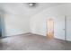 Carpeted bedroom with neutral colors and direct access to another room at 4360 Meadowlark Wing Way, North Las Vegas, NV 89084