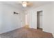 Bright bedroom with a ceiling fan, closet, and adjacent bathroom entrance at 4360 Meadowlark Wing Way, North Las Vegas, NV 89084
