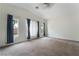 Spacious carpeted bedroom with ample natural light and high ceilings at 4360 Meadowlark Wing Way, North Las Vegas, NV 89084