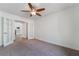Carpeted bedroom has fan and direct access to the living room at 4360 Meadowlark Wing Way, North Las Vegas, NV 89084