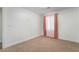 Well lit bedroom with warm colored curtains and carpet at 4360 Meadowlark Wing Way, North Las Vegas, NV 89084