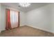 Well lit bedroom with warm colored curtains and carpet at 4360 Meadowlark Wing Way, North Las Vegas, NV 89084