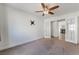 Carpeted bedroom has fan and direct access to the living room at 4360 Meadowlark Wing Way, North Las Vegas, NV 89084