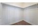 Empty walk-in closet with shelves and neutral carpet at 4360 Meadowlark Wing Way, North Las Vegas, NV 89084