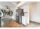 Open kitchen with stainless steel refrigerator and view to the breakfast nook at 4360 Meadowlark Wing Way, North Las Vegas, NV 89084