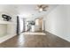 Bright living area with wood-look tile flooring and an open layout to the kitchen at 4360 Meadowlark Wing Way, North Las Vegas, NV 89084