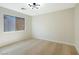 Cozy bedroom with neutral carpet and minimalist decor at 5774 Typecast Rd, Las Vegas, NV 89142