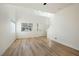 Bright, open living room with wood-look floors and high ceilings at 5774 Typecast Rd, Las Vegas, NV 89142