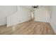 Spacious living room featuring wood-look floors and modern lighting at 5774 Typecast Rd, Las Vegas, NV 89142
