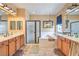 Bright primary bathroom with double sinks, soaking tub, and glass enclosed shower at 664 Blue Crystal Creek Rd, Henderson, NV 89002